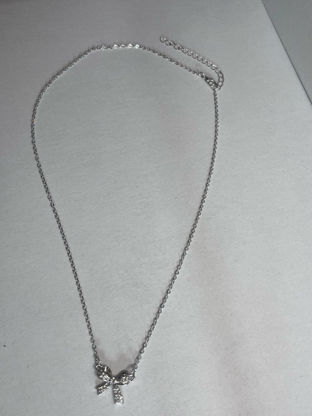Silver Bow Pendant Necklace with Crystal Accents - Silver